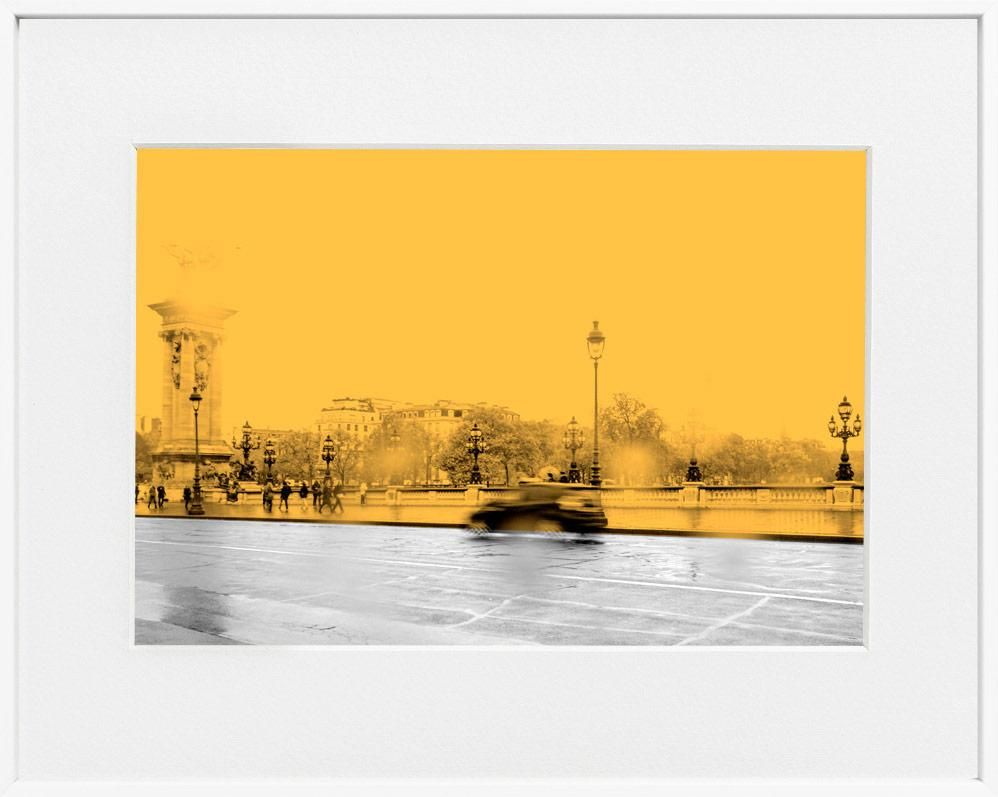 A framed photograph with a limited edition museum-quality print, featuring an abstract representation of a cityscape, predominantly in yellow tones.