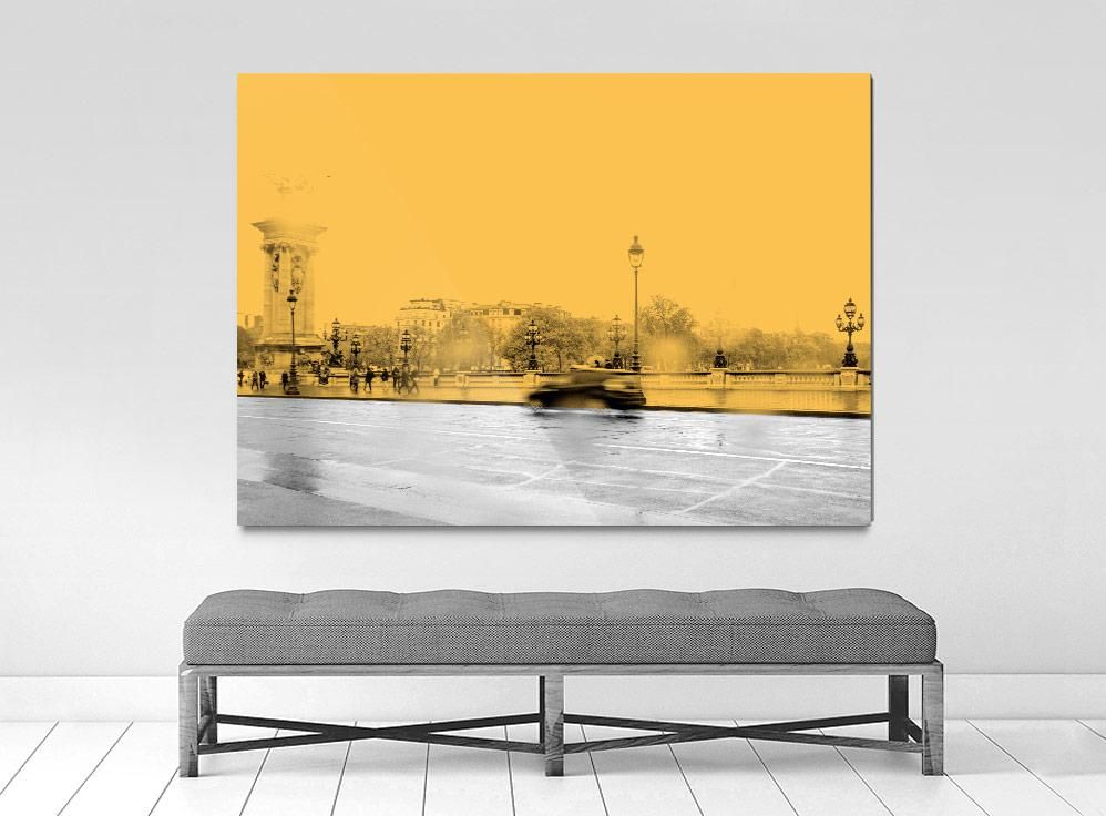 A framed photograph with a limited edition museum-quality print, featuring an abstract representation of a cityscape, predominantly in yellow tones.