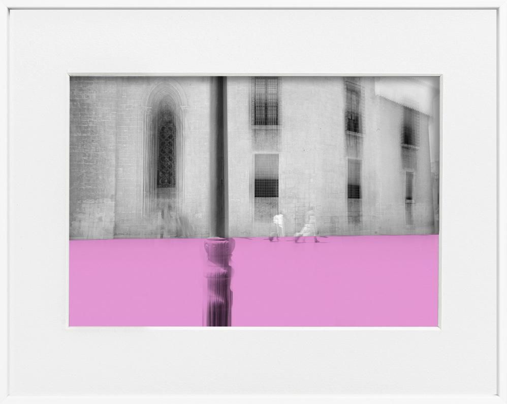 A limited edition museum-quality photograph featuring a grayscale urban scene with a pink horizontal band, titled 'Valencia, 2019'. The image includes architectural elements and a sense of depth.