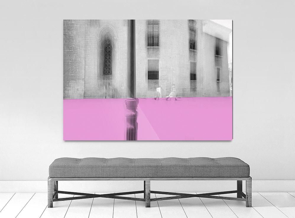 A limited edition museum-quality photograph featuring a grayscale urban scene with a pink horizontal band, titled 'Valencia, 2019'. The image includes architectural elements and a sense of depth.